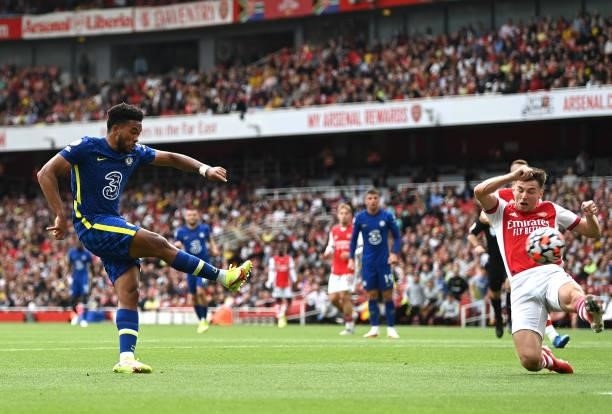 Reece James of Chelsea shoots past Kieran Tierney of Arsenal to score the second goal during the Premier League match between Arsenal and Chelsea at...