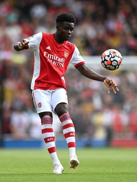 Bukayo Saka of Arsenal controls the ball during the Premier League match between Arsenal and Chelsea at Emirates Stadium on August 22, 2021 in...