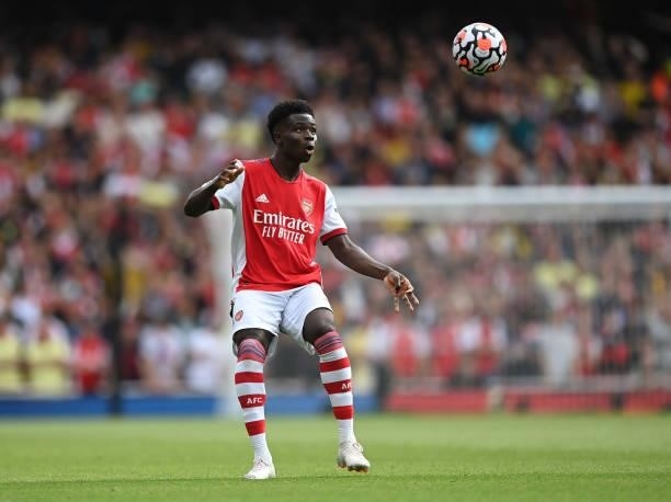 Bukayo Saka of Arsenal controls the ball during the Premier League match between Arsenal and Chelsea at Emirates Stadium on August 22, 2021 in...