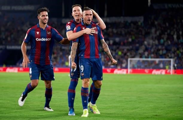 Roger Marti of Levante UD celebrates after scoring his team's first goal with his teammates Carlos Clerc and Rober Pier during the La Liga Santander...