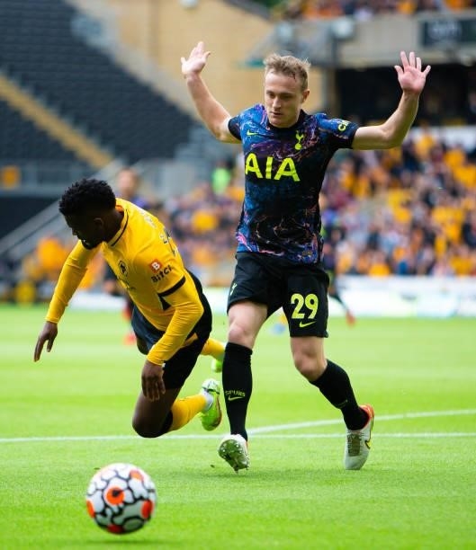 Nelson Semedo of Wolverhampton Wanderers is challenged by Oliver Skipp of Tottenham Hotspur during the Premier League match between Wolverhampton...