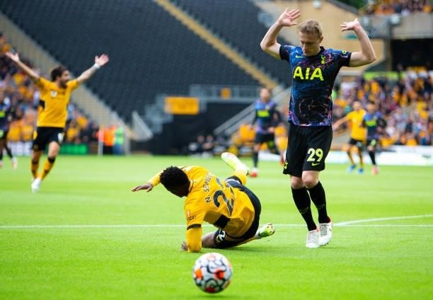 Nelson Semedo of Wolverhampton Wanderers is challenged by Oliver Skipp of Tottenham Hotspur during the Premier League match between Wolverhampton...