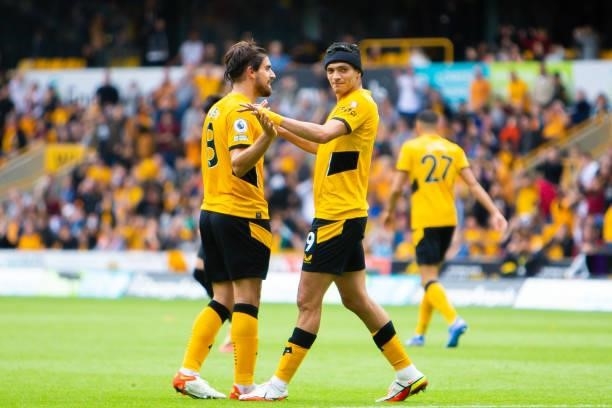 Ruben Neves and Raul Jimenez of Wolverhampton Wanderers react during the Premier League match between Wolverhampton Wanderers and Tottenham Hotspur...