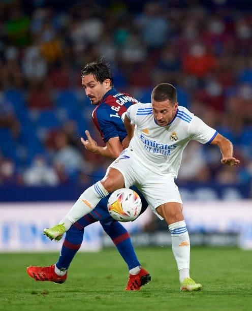 Campana of Levante UD competes for the ball with Eden Hazard of Real Madrid CF during the La Liga Santander match between Levante UD and Real Madrid...