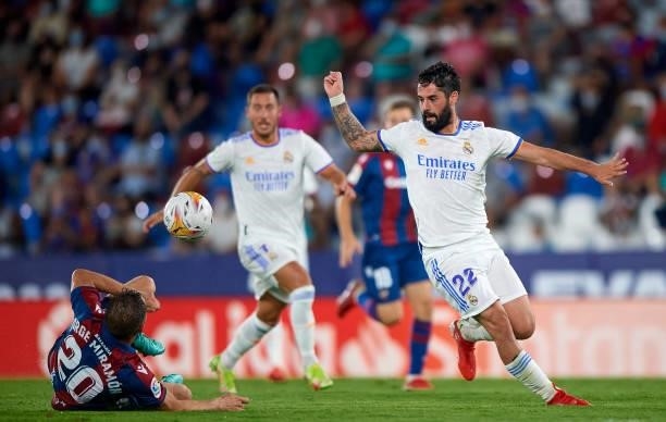Jorge Miramon of Levante UD competes for the ball with Isco Alarcon of Real Madrid CF during the La Liga Santander match between Levante UD and Real...