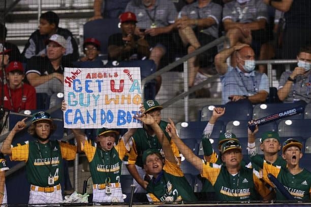 Little League players hold up a sign during the 2021 Little League Classic at Bowman Field on August 22, 2021 in South Williamsport, Pennsylvania.