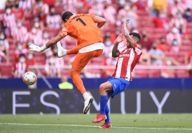 Kiko Casilla of Elche CF mishits the ball to allow Angel Correa of Atletico de Madrid to score Atletico's opening goal during the La Liga Santander...