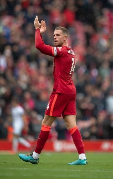 Jordan Henderson of Liverpool applauds the fans after the Premier League match between Liverpool and Burnley at Anfield on August 21, 2021 in...