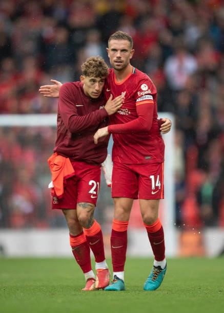 Jordan Henderson and Konstantinos Tsimikas of Liverpool embrace after the Premier League match between Liverpool and Burnley at Anfield on August 21,...
