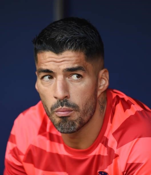 Luis Suarez of Atletico de Madrid looks on from the substitutes bench prior to the La Liga Santander match between Club Atletico de Madrid and Elche...