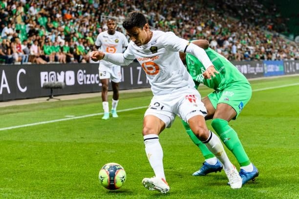Benjamin Andre of Lille is chased by Zaydou Youssouf of Saint-Étienne during the Ligue 1 Uber Eats match between Saint Etienne and Lille at Stade...