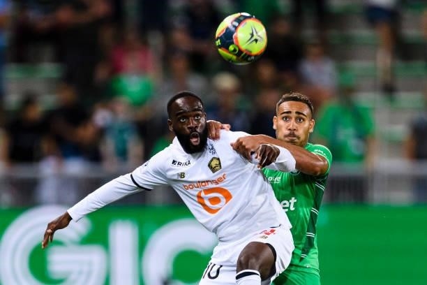 Yvann Macon of Saint-Étienne battles for the ball with Jonathan Ikone of Lille during the Ligue 1 Uber Eats match between Saint Etienne and Lille at...