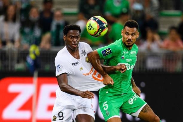 Jonathan David of Lille fights for the ball with Timothée Kolodziejczak of Saint-Étienne during the Ligue 1 Uber Eats match between Saint Etienne and...