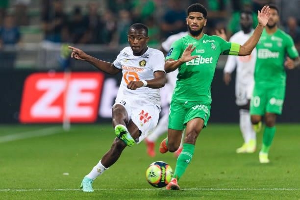 Tiago Djalo of Lille is chased by Mahdi Camara of Saint-Étienne during the Ligue 1 Uber Eats match between Saint Etienne and Lille at Stade...