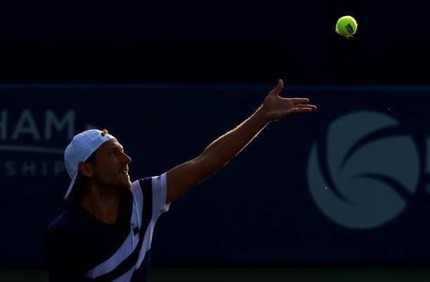 Feliciano Lopez of Spain serves to Lucas Pouille of France during the Winston-Salem Open at Wake Forest Tennis Complex on August 23, 2021 in Winston...