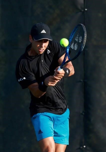 Jaume Munar of Spain returns a shot to Yosuke Watanuki of Japan on Day 3 of the Winston-Salem Open at Wake Forest Tennis Complex on August 23, 2021...