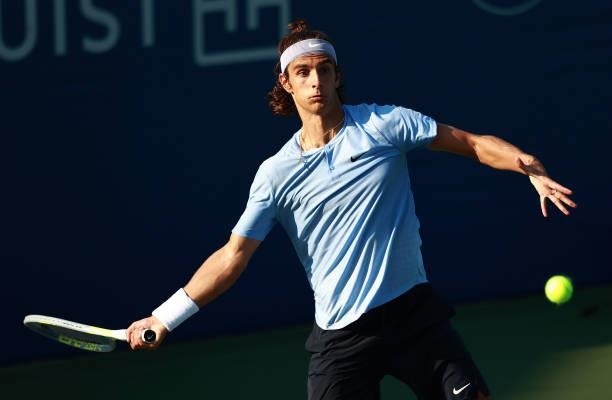 Lorenzo Musetti of Italy returns a shot to Federico Coria of Argentina on Day 3 of the Winston-Salem Open at Wake Forest Tennis Complex on August 23,...