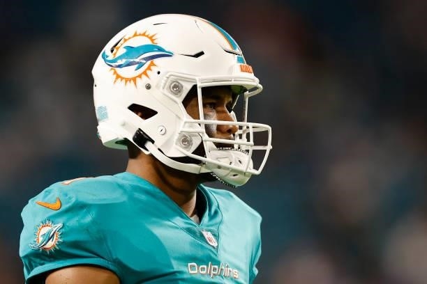 Tua Tagovailoa of the Miami Dolphins looks on during a preseason game against the Atlanta Falcons at Hard Rock Stadium on August 21, 2021 in Miami...