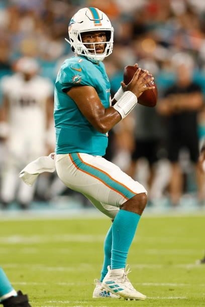 Tua Tagovailoa of the Miami Dolphins in action against the Atlanta Falcons during a preseason game at Hard Rock Stadium on August 21, 2021 in Miami...