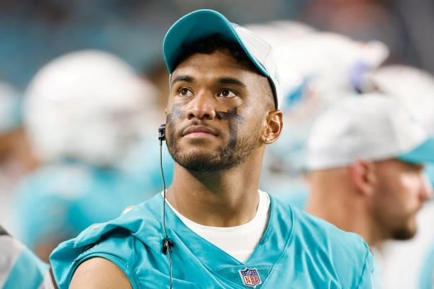 Tua Tagovailoa of the Miami Dolphins looks on against the Atlanta Falcons during a preseason game at Hard Rock Stadium on August 21, 2021 in Miami...