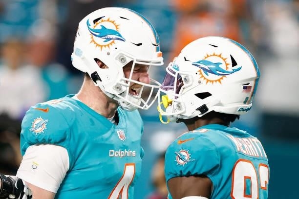 Reid Sinnett and Kirk Merritt of the Miami Dolphins celebrate a touchdown against the Atlanta Falcons during a preseason game at Hard Rock Stadium on...