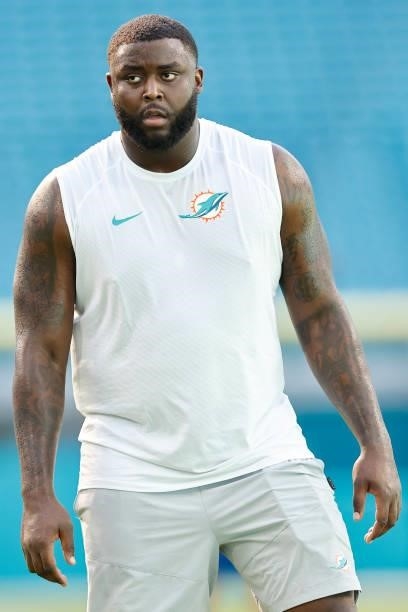 Greg Little of the Miami Dolphins looks on against the Atlanta Falcons during a preseason game at Hard Rock Stadium on August 21, 2021 in Miami...