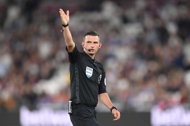 Match referee Michael Oliver looks on during the Premier League match between West Ham United and Leicester City at The London Stadium on August 23,...