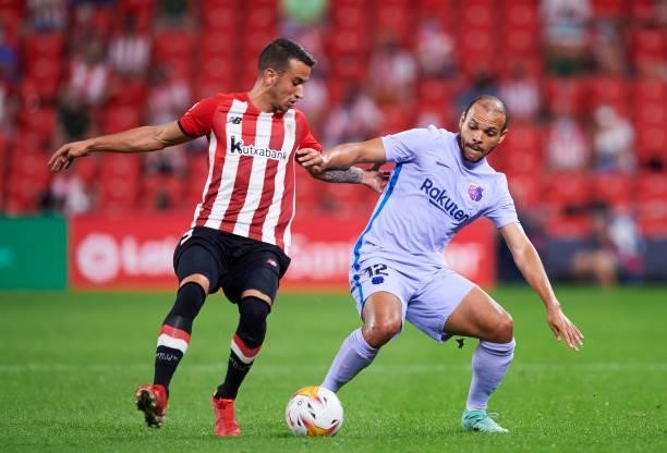 Martin Braithwaite of FC Barcelona duels for the ball with Inigo Lekue of Athletic Club during the LaLiga Santander match between Athletic Club and...