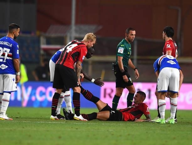 Simon Kjaer of AC Milan rescues his injured team-mate during the Serie A match between UC Sampdoria v AC Milan at Stadio Luigi Ferraris on August 23,...