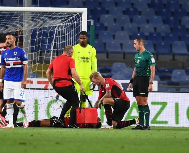 Simon Kjaer of AC Milan rescues his injured team-mate during the Serie A match between UC Sampdoria v AC Milan at Stadio Luigi Ferraris on August 23,...