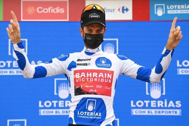 Damiano Caruso of Italy and Team Bahrain Victorious celebrates winning the Polka Dot Mountain Jersey on the podium ceremony after the 76th Tour of...