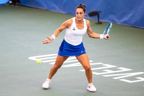 Martina Trevisan of Italy returns a serve to Shuai Zhang of China during the first set of their match at Jacobs Pavilion on August 23, 2021 in...