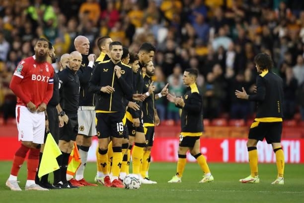 Conor Coady of Wolverhampton Wanderers looks on as he lines up with teammates prior to the Carabao Cup Second Round match between Nottingham Forest...