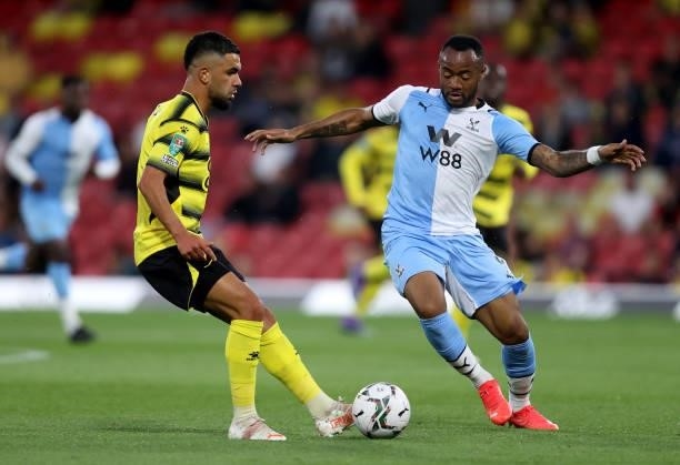 Jordan Ayew of Crystal Palace challenges Imrân Louza of during the Carabao Cup second round match between Watford and Crystal Palace at Vicarage Road...