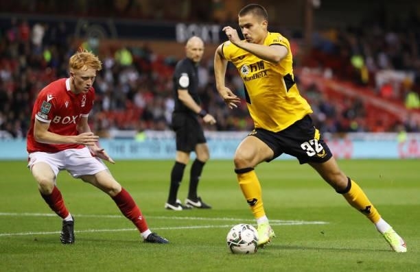 Leander Dendoncker of Wolverhampton Wanderers takes on Oliver Hammond of Nottingham Forest during the Carabao Cup Second Round match between...