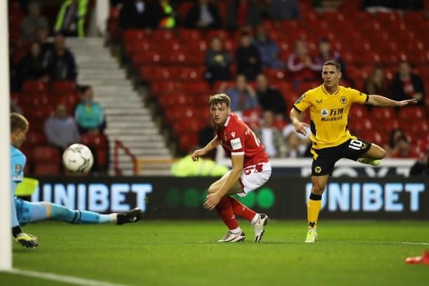 Daniel Podence of Wolverhampton Wanderers shoots under pressure from Riley Harbottle of Nottingham Forest during the Carabao Cup Second Round match...
