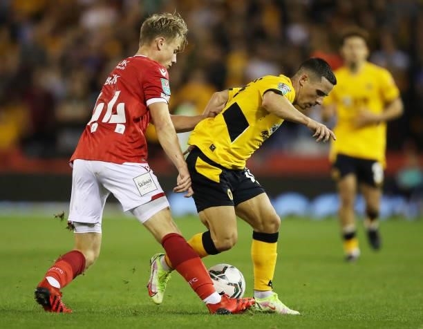 Fin Back of Nottingham Forest tackles Daniel Podence of Wolverhampton Wanderers during the Carabao Cup Second Round match between Nottingham Forest...