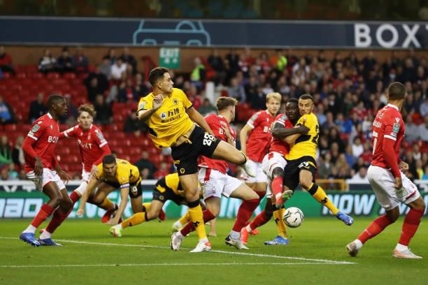 Max Kilman of Wolverhampton Wanderers misses the ball during the Carabao Cup Second Round match between Nottingham Forest and Wolverhampton Wanderers...