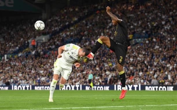 Leeds player Jack Harrison is challenged by Crewe defender Kayne Ramsey during the Carabao Cup Second Round match between Leeds United and Crewe...