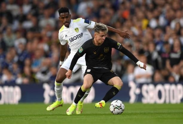 Leeds player Junior Firpo challenges Crewe player Ben Knight during the Carabao Cup Second Round match between Leeds United and Crewe Alexandra at...
