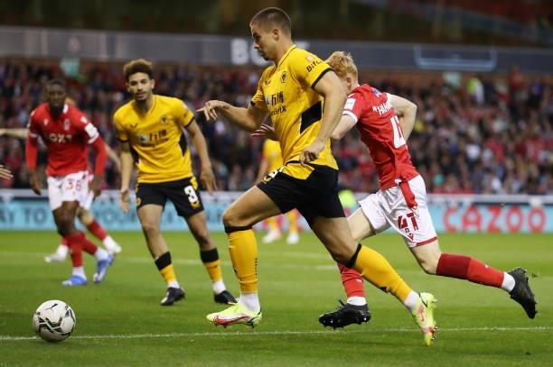 Leander Dendoncker of Wolverhampton Wanderers runs past Oliver Hammond of Nottingham Forest during the Carabao Cup Second Round match between...