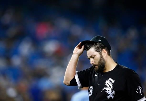 Lance Lynn of the Chicago White Sox looks on as he walks to the dugout during a MLB game against the Toronto Blue Jays at Rogers Centre on August 23,...