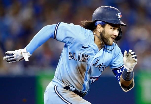 Bo Bichette of the Toronto Blue Jays runs to first base during a MLB game against the Chicago White Sox at Rogers Centre on August 23, 2021 in...