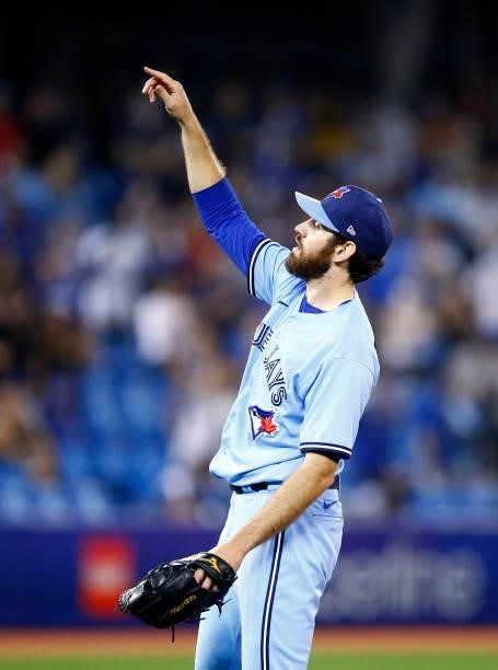 Jordan Romano of the Toronto Blue Jays signals to the dugout in the ninth inning during a MLB game against the Chicago White Sox at Rogers Centre on...