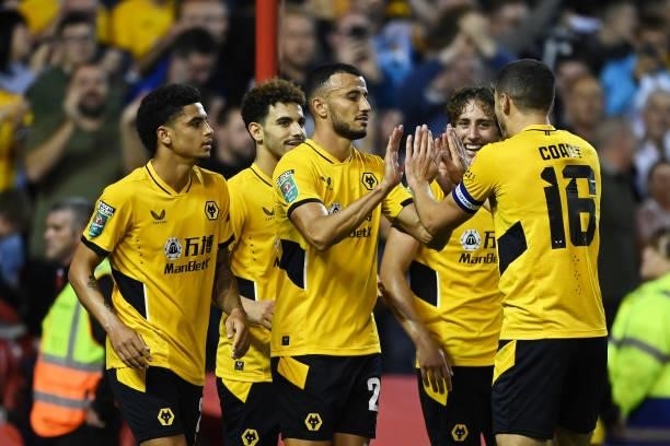 Romain Saiss of Wolverhampton Wanderers celebrates with Conor Coady and teammates after scoring their team's first goal during the Carabao Cup Second...