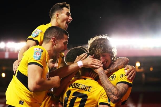 Daniel Podence of Wolverhampton Wanderers is congratulated by Conor Coady, Fabio Silva and teammates after scoring their team's second goal during...