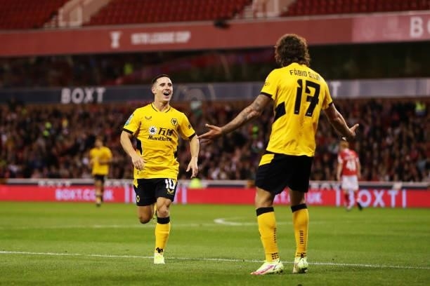 Daniel Podence of Wolverhampton Wanderers celebrates with teammate Fabio Silva after scoring their team's second goal during the Carabao Cup Second...