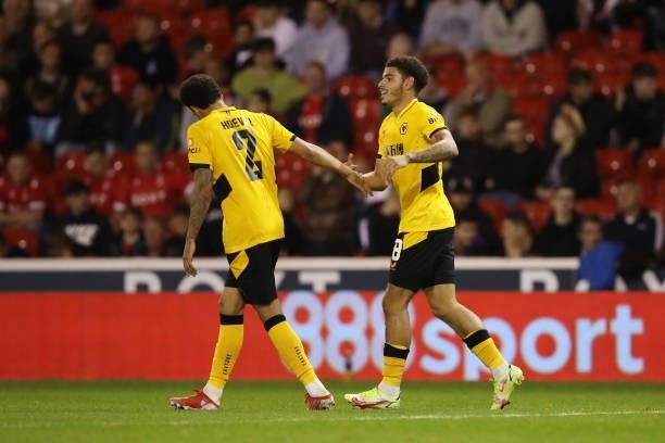 Morgan Gibbs-White of Wolverhampton Wanderers celebrates with teammate Ki-Jana Hoever after scoring their team's fourth goal during the Carabao Cup...