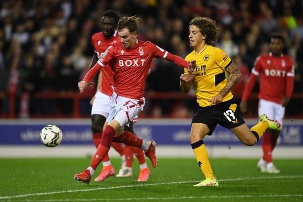 James Garner of Nottingham Forest battles for possession with Fabio Silva of Wolverhampton Wanderers during the Carabao Cup Second Round match...