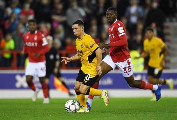 Daniel Podence of Wolverhampton Wanderers runs with the ball under pressure from Tyrese Fornah of Nottingham Forest during the Carabao Cup Second...